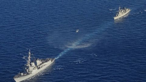In this photo provided by the Greek National Defense Ministry, warships take part in a Greek-US military exercise south of the island of Crete, on Aug. 24, 2020. 