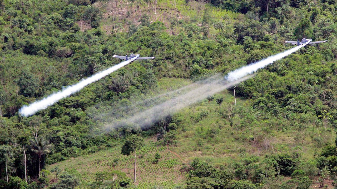 Two AT- 802 planes fumigate coca fields in San Miguel, 400 miles south of Bogota, Colombia, on Dec. 11, 2006.