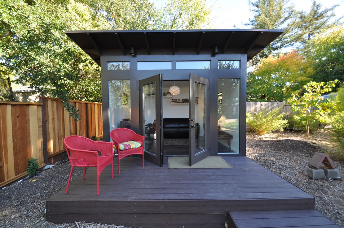 Rather than buying a new house for home office space, some remote workers are adding backyard sheds like this one by Studio Shed.