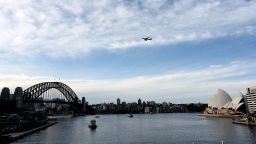 The last Qantas Boeing 747 airliner flies over the Sydney Harbour Bridge during its farewell flight to the US on July 22, 2020. - The downturn in the airline industry following travel restrictions imposed by the COVID-19 outbreak forced Qantas to retire its grounded 747s after flying with the Australian carrier for almost 50 years. (Photo by Saeed KHAN / AFP) (Photo by SAEED KHAN/AFP via Getty Images)