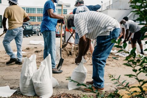 People make sandbags at St. Raymond Church in New Orleans.