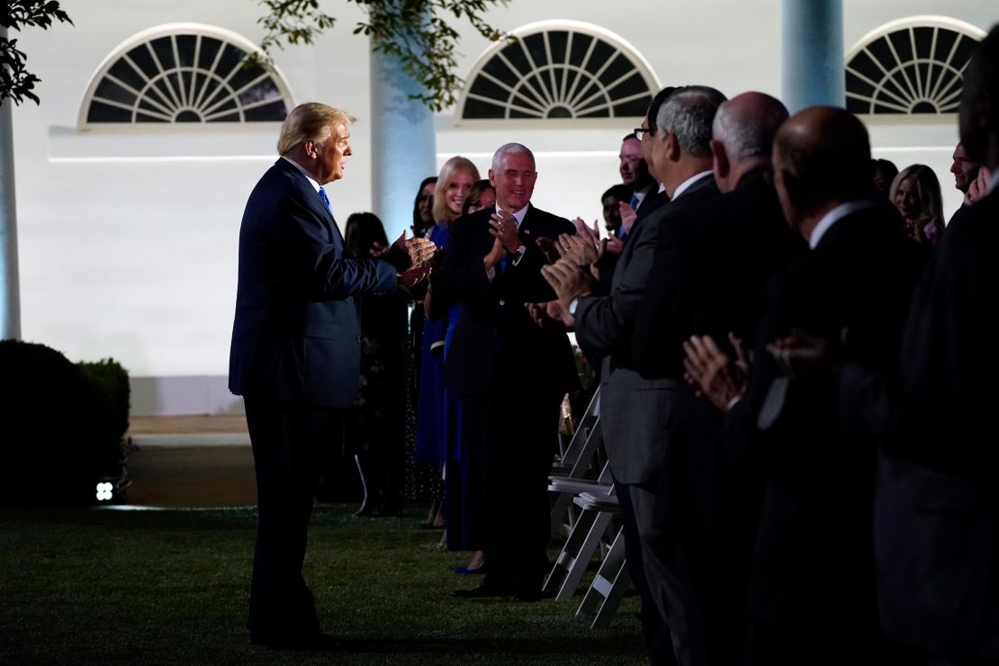 President Donald Trump arrives to listen to first lady Melania Trump speak at the 2020 Republican National Convention from the Rose Garden of the White House, Tuesday, Aug. 25, 2020, in Washington. 