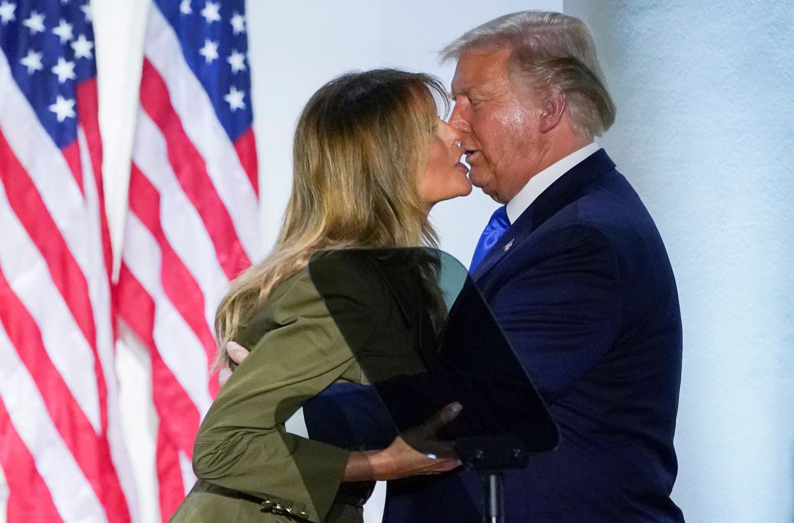 The Trumps kiss after Melania's speech.