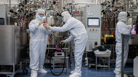 In this picture taken on April 29, 2020, engineers are seen working in a  laboratory at the Sinovac Biotech facilities in Beijing, China.