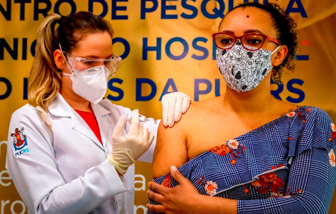 A Brazilian volunteer receives a coronavirus vaccine produced by Chinese company Sinovac Biotech at the Sao Lucas Hospital in Porto Alegre, southern Brazil on August 8.