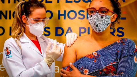 A Brazilian volunteer receives a coronavirus vaccine produced by Chinese company Sinovac Biotech at the Sao Lucas Hospital in Porto Alegre, southern Brazil on August 8.