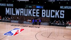 LAKE BUENA VISTA, FLORIDA - AUGUST 26: Referees stand on an empty court before the start of a scheduled game between the Milwaukee Bucks and the Orlando Magic for Game Five of the Eastern Conference First Round during the 2020 NBA Playoffs at AdventHealth Arena at ESPN Wide World Of Sports Complex on August 26, 2020 in Lake Buena Vista, Florida. NOTE TO USER: User expressly acknowledges and agrees that, by downloading and or using this photograph, User is consenting to the terms and conditions of the Getty Images License Agreement. (Photo by Kevin C. Cox/Getty Images)