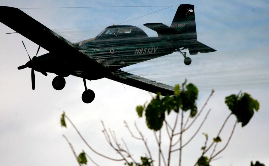 A plane sprays coca fields in San Miguel, on Colombia's southern border with Ecuador on Dec. 15, 2006.