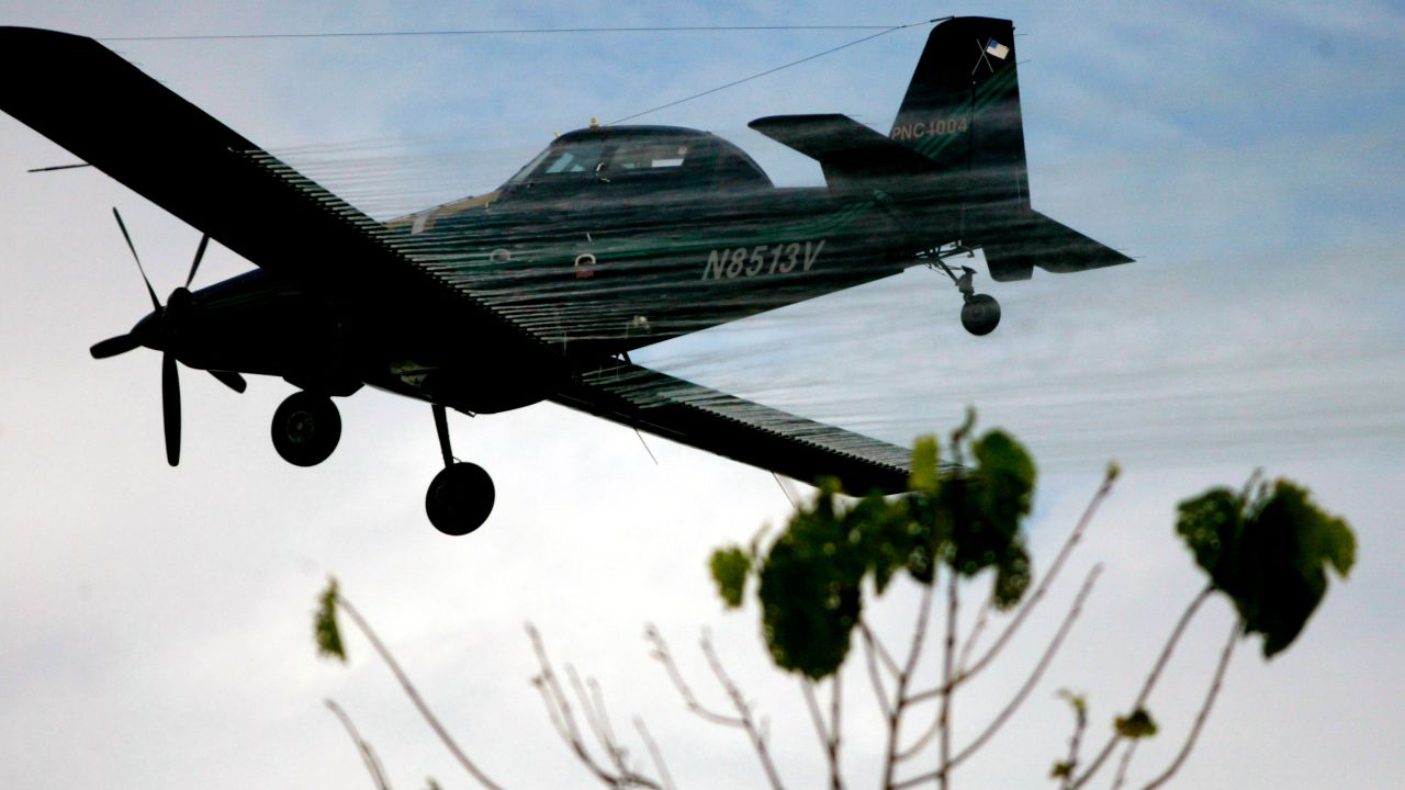 A plane sprays coca fields in San Miguel, on Colombia's southern border with Ecuador on Dec. 15, 2006.