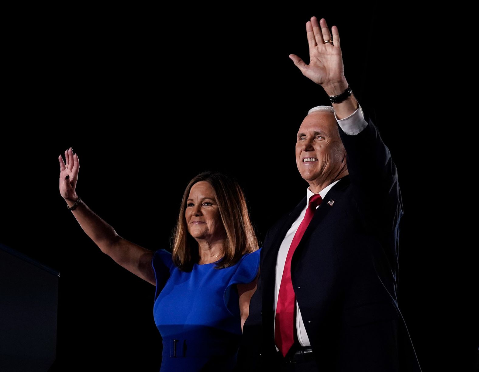 Pence greets the Fort McHenry crowd with his wife, Karen.