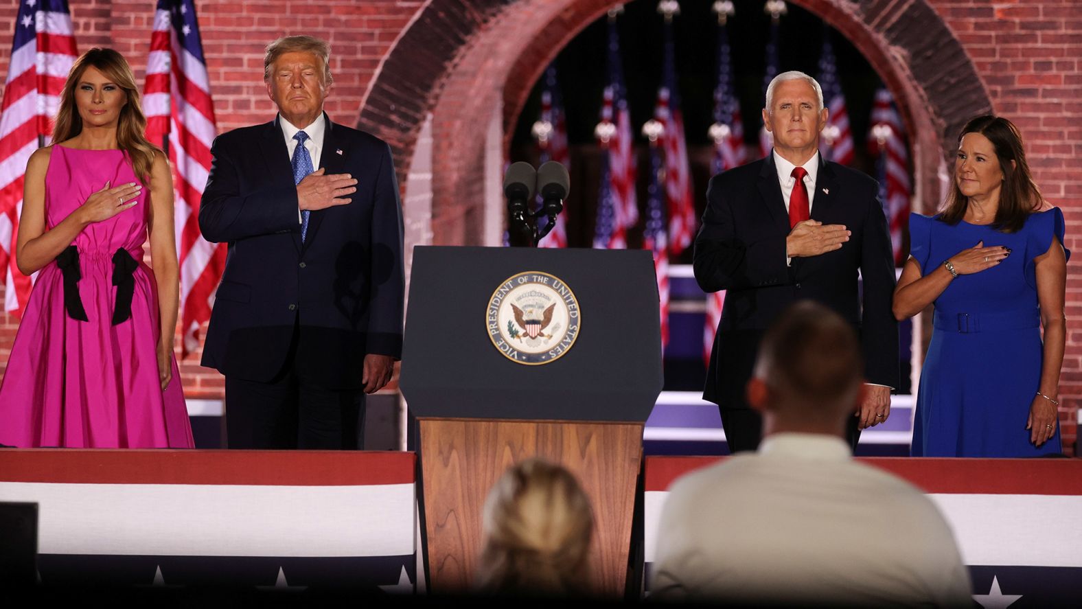 Vice President Mike Pence and his wife, Karen, are joined on stage by President Trump and the first lady after Pence's speech Wednesday. Pence spoke from Fort McHenry in Baltimore.