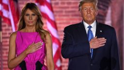 US First Lady Melania Trump and US President Donald Trump listen to the US National Anthem, "The Star-Spangled Banner", during the third night of the Republican National Convention at Fort McHenry National Monument in Baltimore, Maryland, August 26, 2020. (Photo by SAUL LOEB / AFP) (Photo by SAUL LOEB/AFP via Getty Images)
