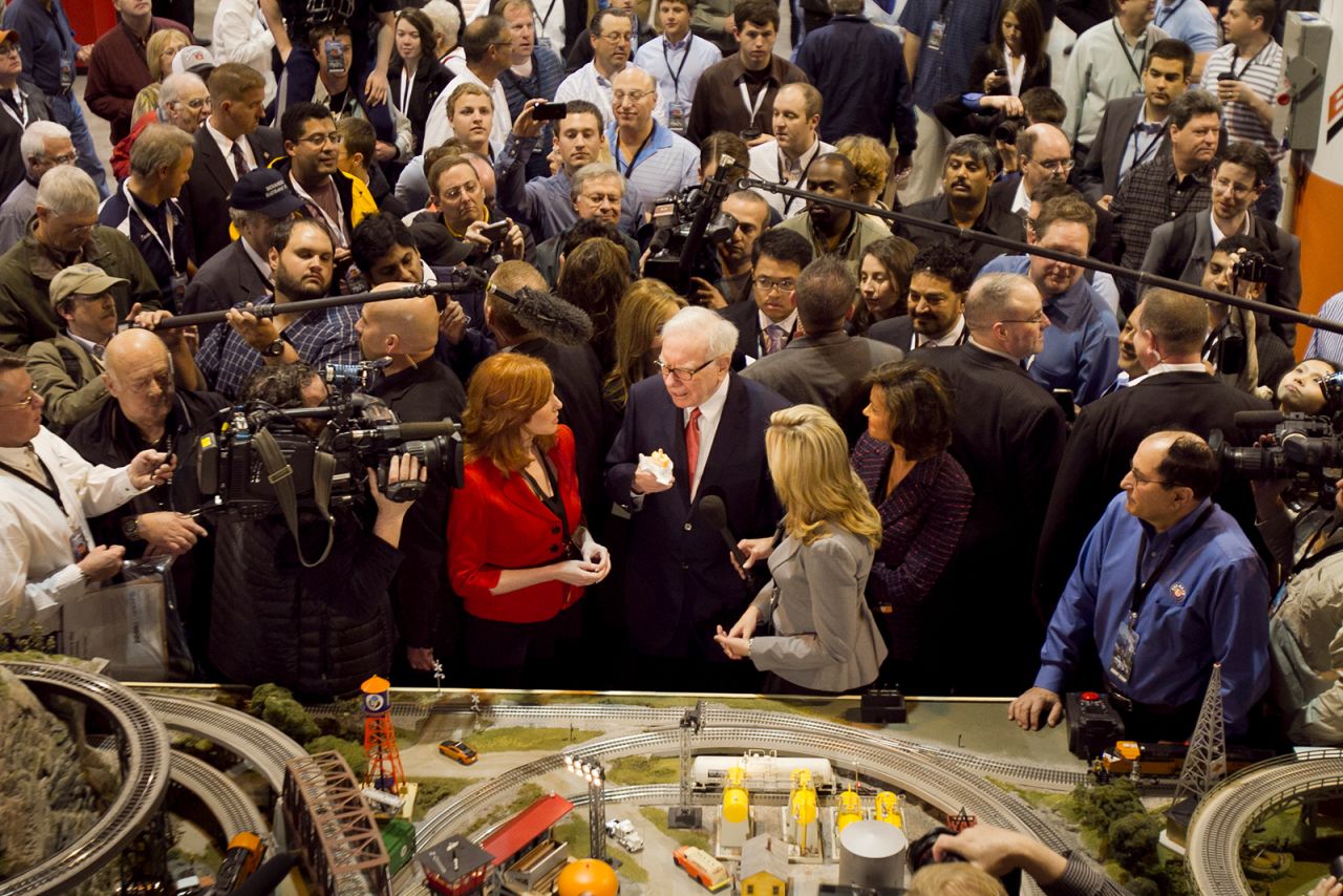 Buffett is mobbed by journalists and shareholders during Berkshire Hathaway's annual shareholders meeting in 2011.