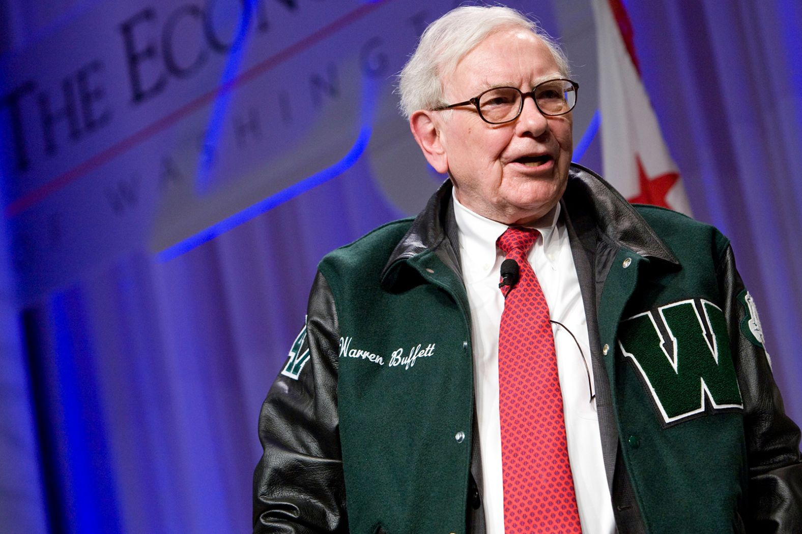 Buffett wears a Woodrow Wilson High School jacket as he attends an event in Washington, DC, in 2012. Buffett graduated from the Washington high school in 1947.