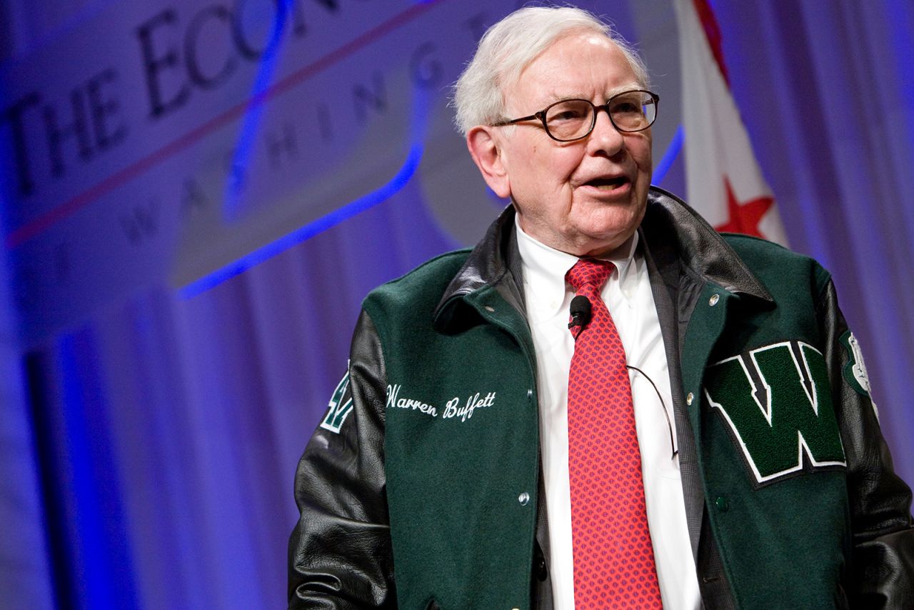 Buffett wears a Woodrow Wilson High School jacket as he attends an event in Washington, DC, in 2012. Buffett graduated from the Washington high school in 1947.