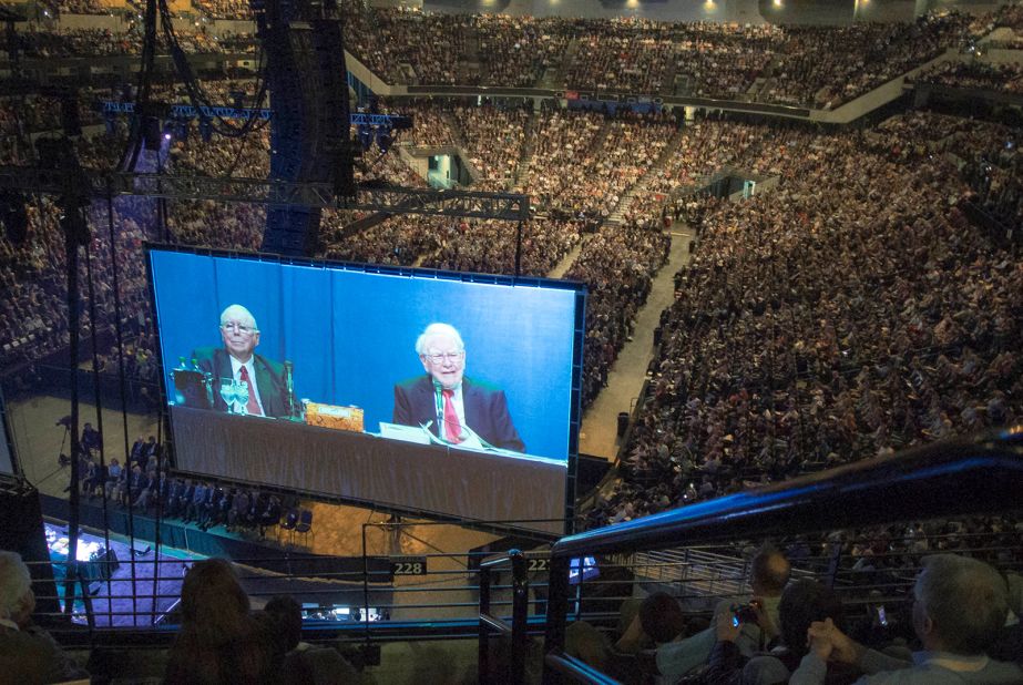 Buffett and Berkshire Hathaway Vice Chairman Charlie Munger are seen on a giant screen during the Berkshire Hathaway shareholders meeting in 2013.