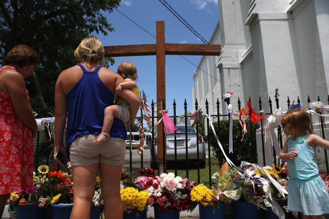 People visit a makeshift shrine in July 2015 to the victims of the June 17, 2015, shooting at the Emanuel African Methodist Episcopal church.