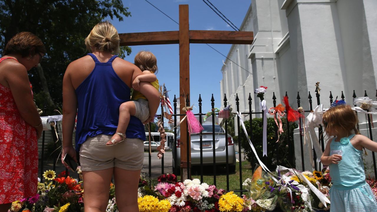 People visit a makeshift shrine in July 2015 to the victims of the June 17, 2015, shooting at the Emanuel African Methodist Episcopal church.