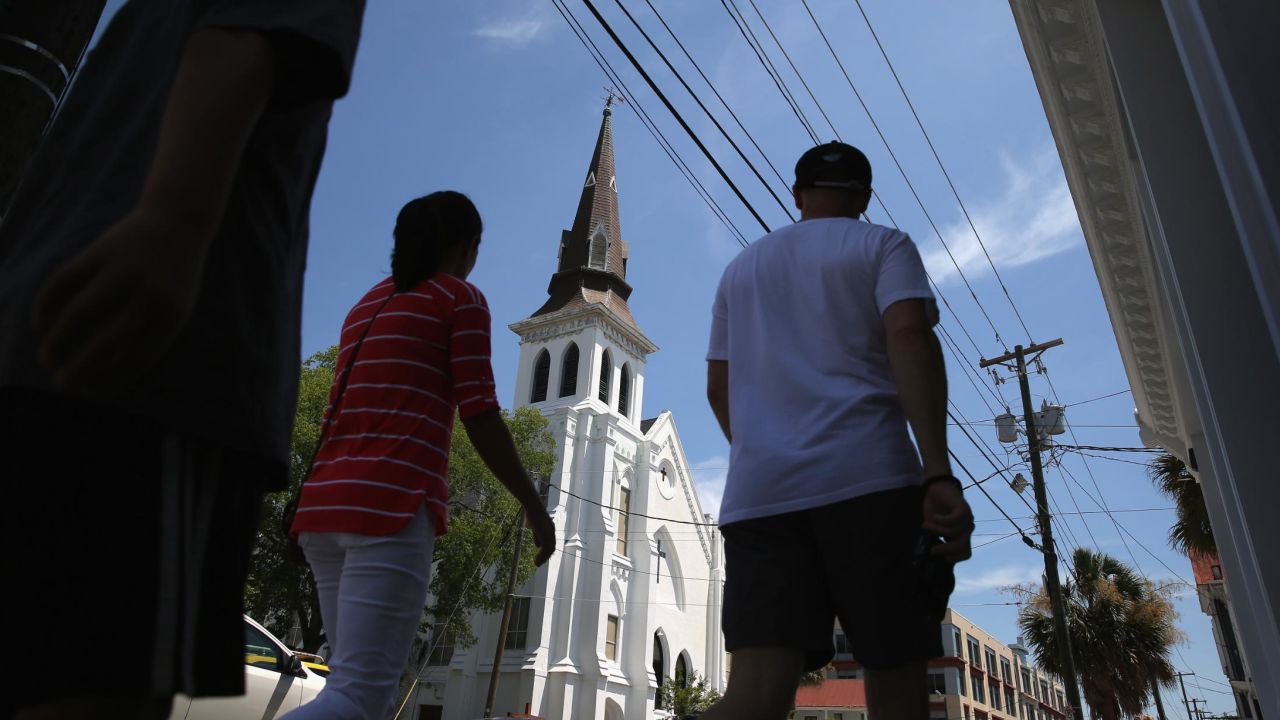 People walk past the Emanuel African Methodist Episcopal church in 2015.