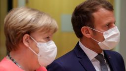 Germany's Chancellor Angela Merkel (L) and France's President Emmanuel Macron attend prior the start of the European Union Council in Brussels on July 17, 2020, as the leaders of the European Union hold their first face-to-face summit over a post-virus economic rescue plan. - The EU has been plunged into a historic economic crunch by the coronavirus crisis, and EU officials have drawn up plans for a huge stimulus package to lead their countries out of lockdown. (Photo by Stephanie Lecocq/Pool/AFP/Getty Images)