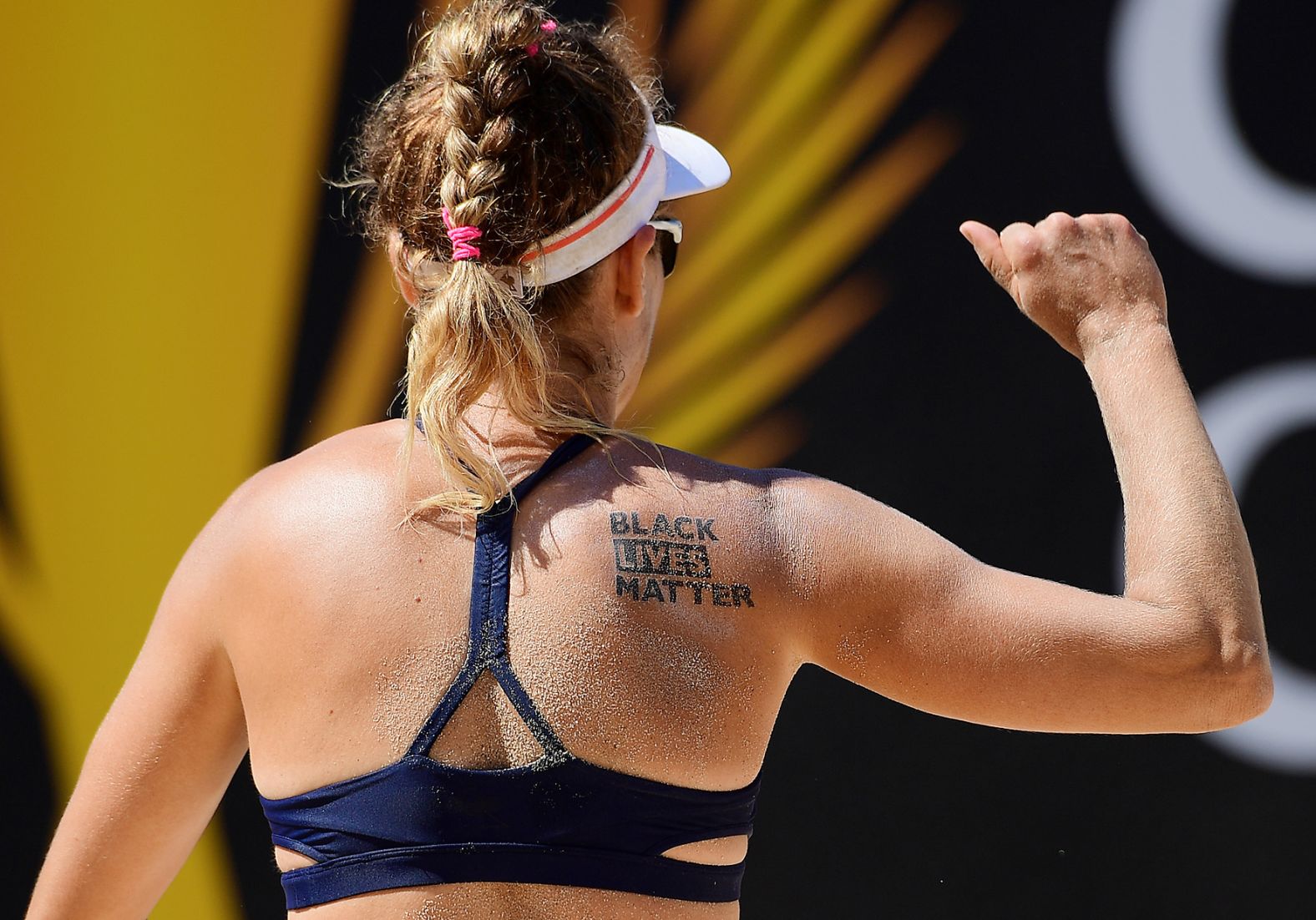 Beach volleyball player April Ross wears a temporary Black Lives Matter tattoo during a match in Long Beach, California, on July 19.