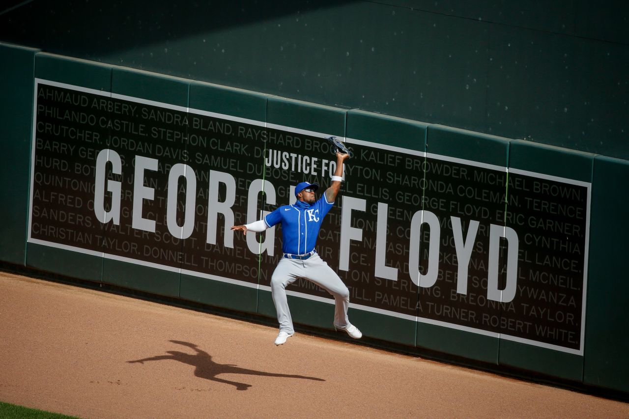 Kansas City outfielder Jorge Soler catches a ball in front of a George Floyd sign in Minneapolis on August 15.