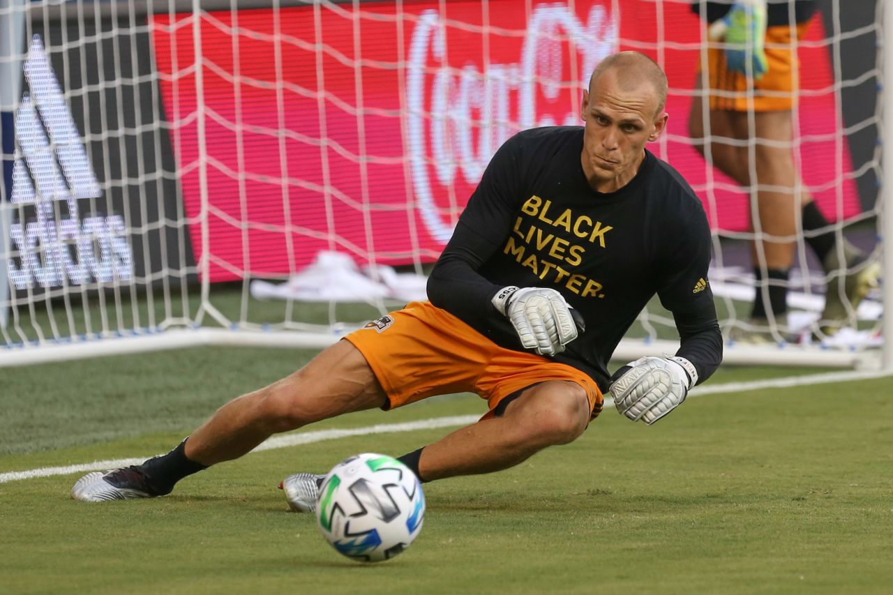 Houston Dynamo goalkeeper Cody Cropper warms up in a Black Lives Matter T-shirt on August 25.
