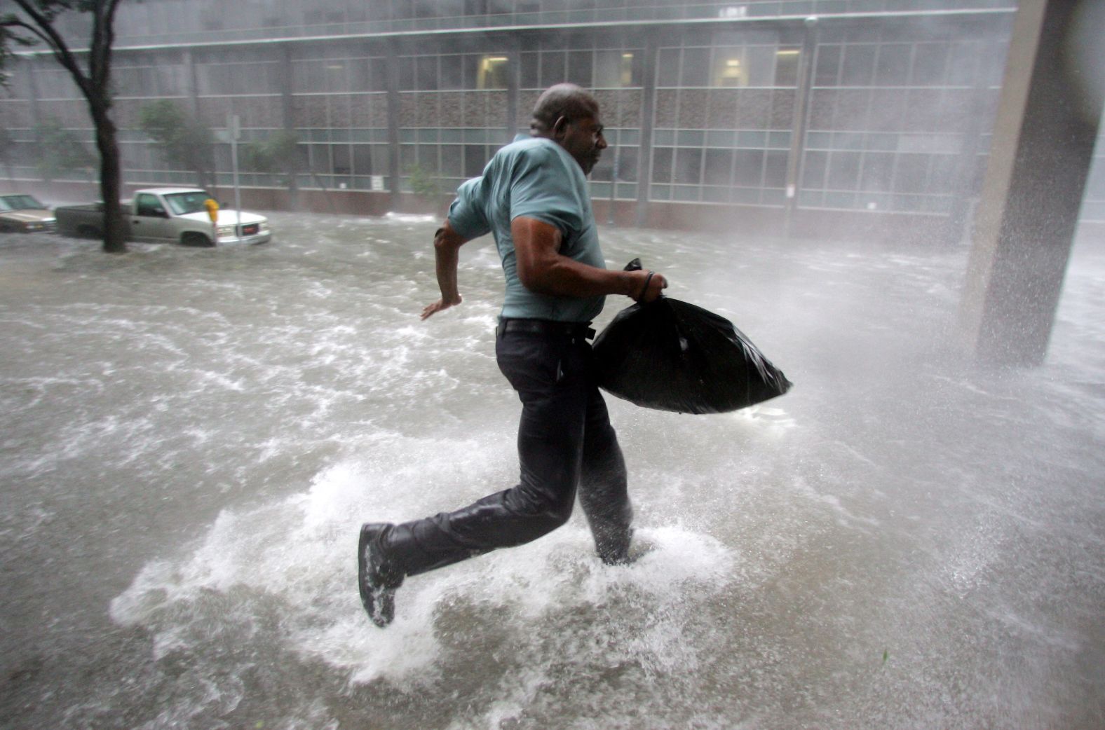 Arnold James tries to keep his feet as a strong gust nearly blows him over in New Orleans. The roof on his home blew off, forcing him to seek shelter at the Superdome.