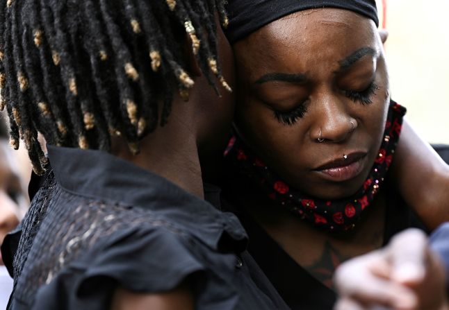 Letetra Wideman and Zanetia Blake, sisters of Jacob Blake, embrace during a news conference outside the Kenosha County Courthouse.