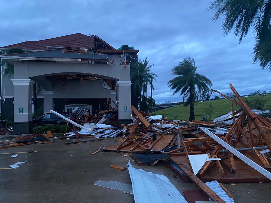 This photo from a reporter at CNN affiliate station WSVN shows the wind damage to the front entrance of a La Quinta Inn in Lake Charles.