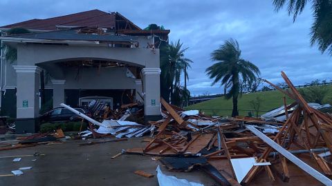 This photo from a reporter at CNN affiliate station WSVN shows the wind damage to the front entrance of a La Quinta Inn in Lake Charles.