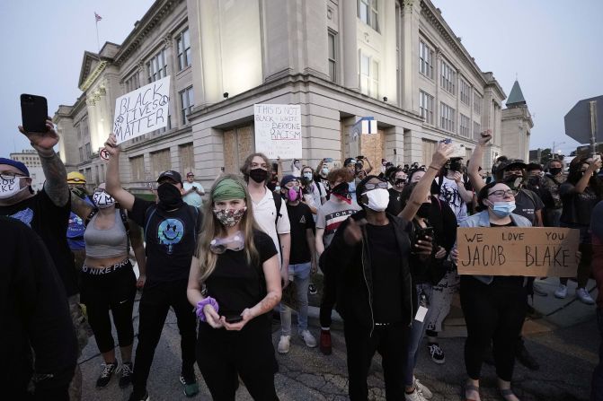 People gather to protest on August 25.