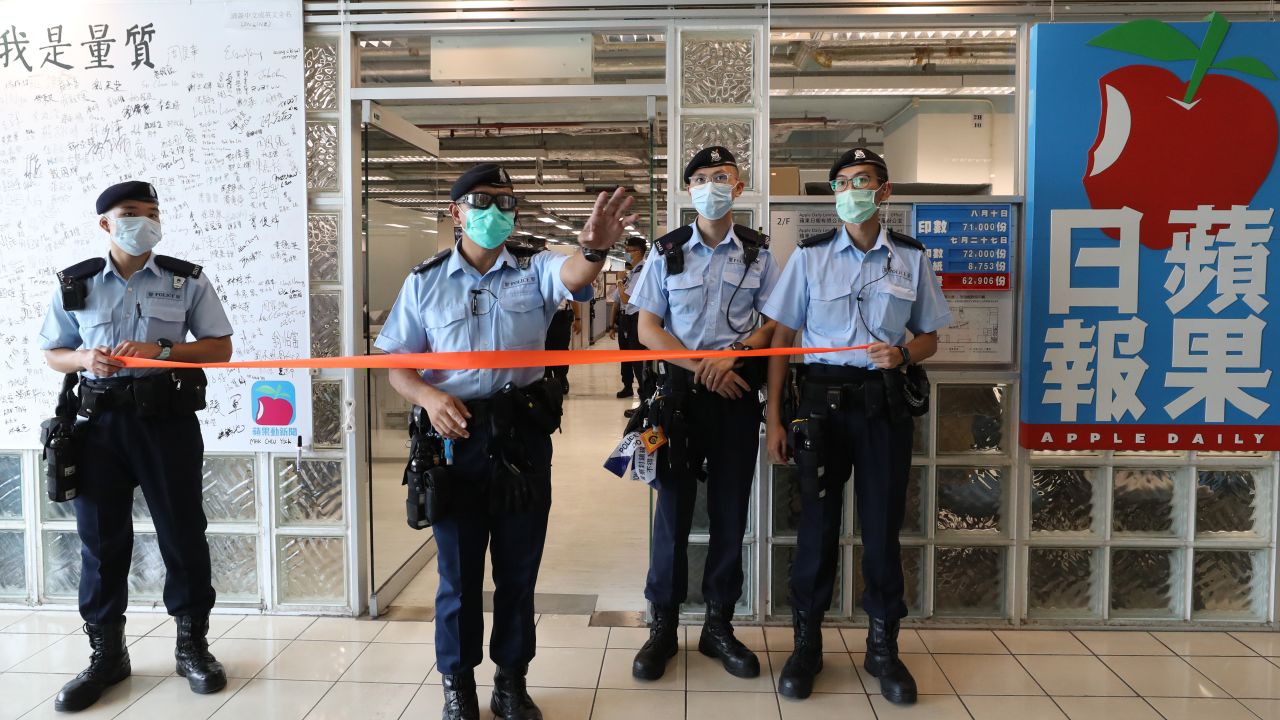 HONG KONG, CHINA - AUGUST 10: A handout photo from Apple Daily showing police officers during a search at the headquarters of Apple Daily after media mogul, Hong Kong business tycoon Jimmy Lai, was arrested at his home on August 10, 2020 in Hong Kong, China. Hong Kong police arrested seven people, including business tycoon Jimmy Lai on Monday on charges of violating the territory's new national security law. Police officers raided the pro-democracy newspapers headquarter while leading Mr. Lai and the company's chief executive, Cheung Kim-hung, through the offices in handcuffs. (Photo by Handout/Getty Images)