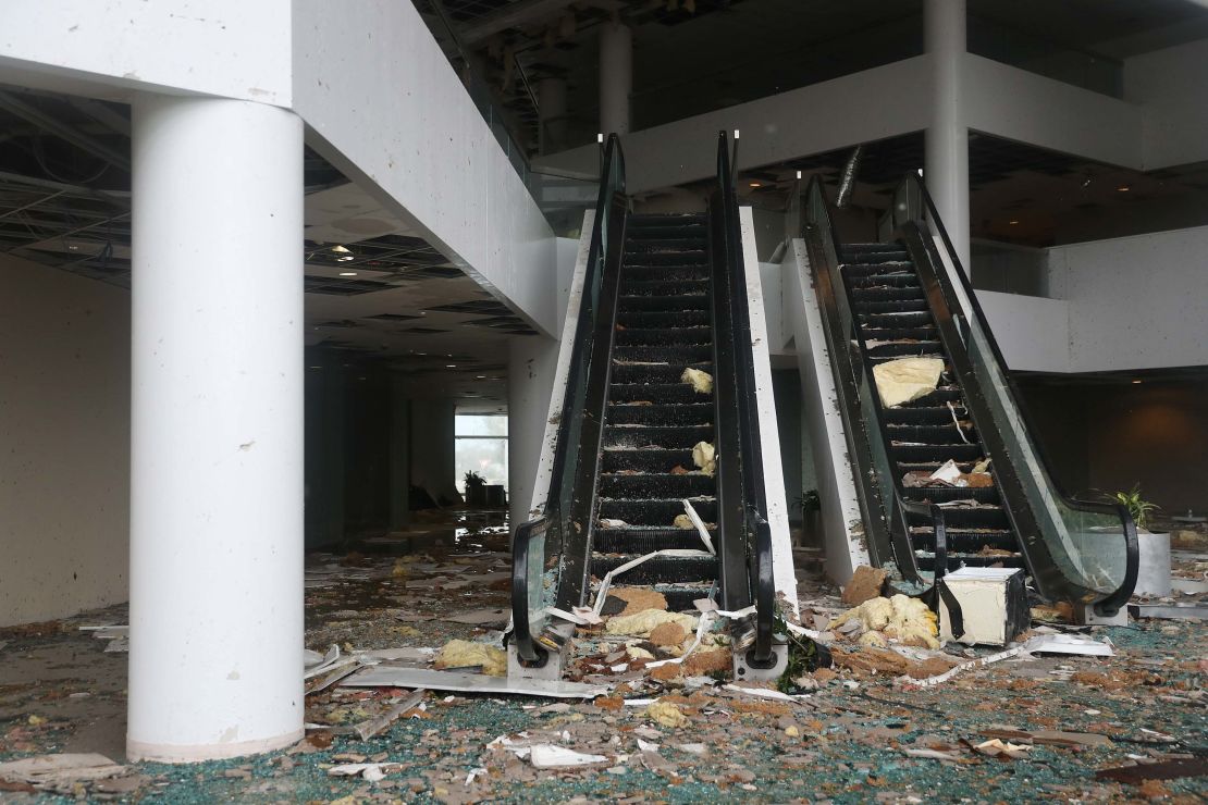 Debris is strewn down an escalator in Capitol One Bank Tower on Thursday in Lake Charles.