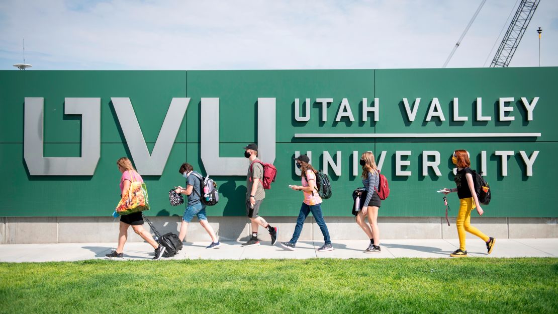 Utah Valley University students walk to campus after being dropped off by the UVX bus in Orem, Utah, on Monday, August 24, 2020. 