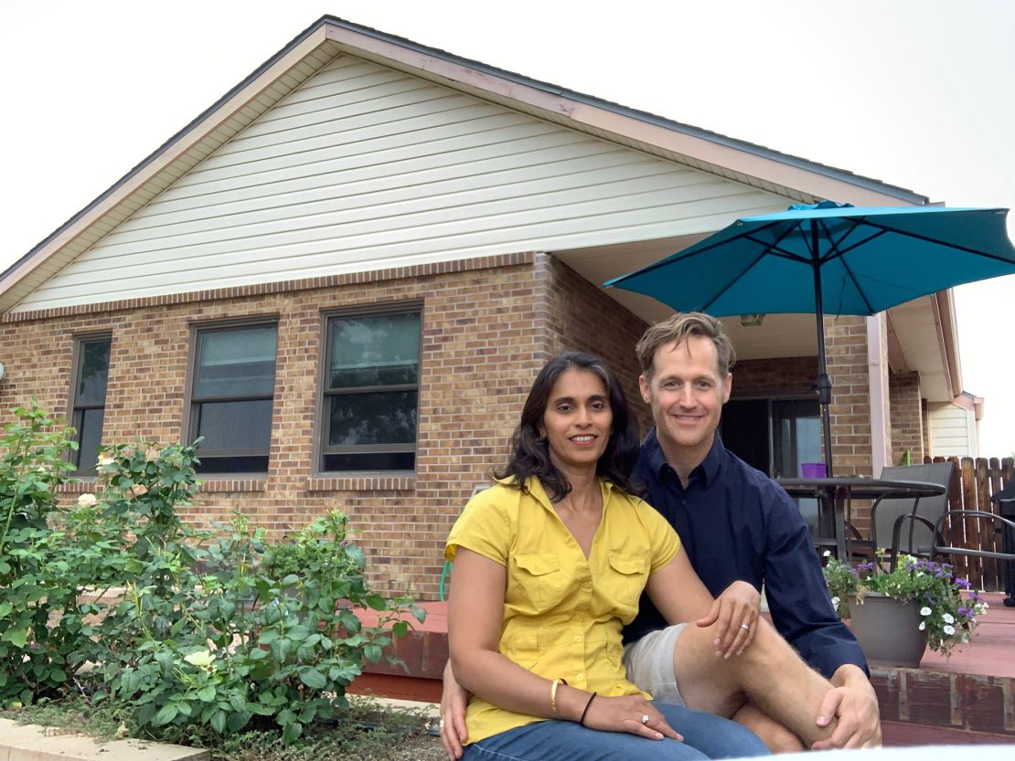 Aterah Nusrat and Morgan Dix left Boston during the pandemic. Here they are in front of their new home in Longmont, Colorado. 