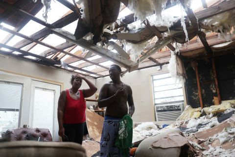 Latasha Myles and Howard Anderson stand in their Lake Charles living room, which is where they were sitting when the roof blew off around 2:30 a.m. on August 27.