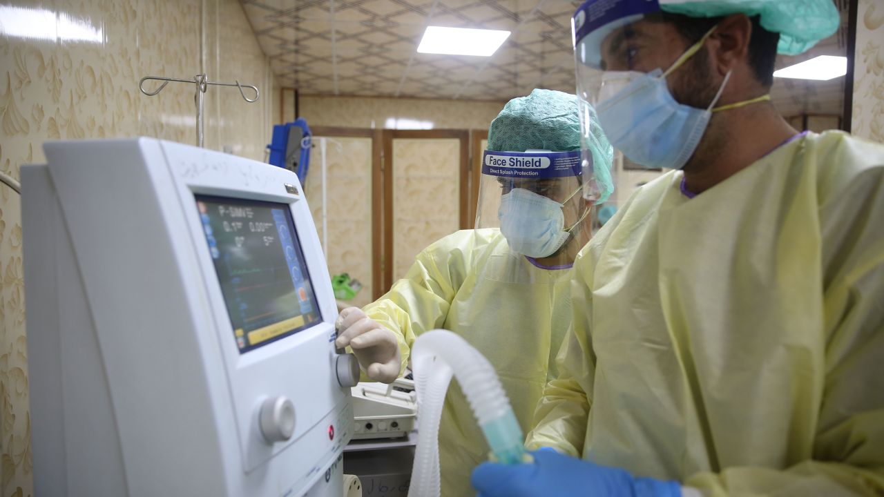 Doctors wearing protective gear check equipment at the first specialized hospital for coronavirus cases in Idlib, northern Syria. 