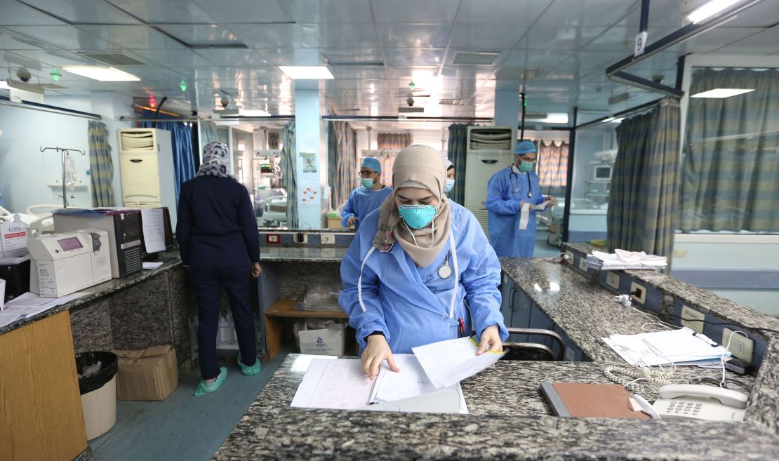 Health workers prepare quarantine rooms at the Al Mojtahed Hospital in Damascus, Syria, on 19 March.