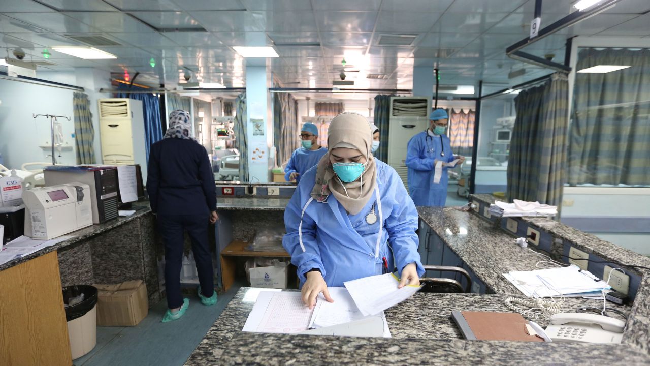 Health workers prepare quarantine rooms at the Al Mojtahed Hospital in Damascus, Syria, on 19 March.