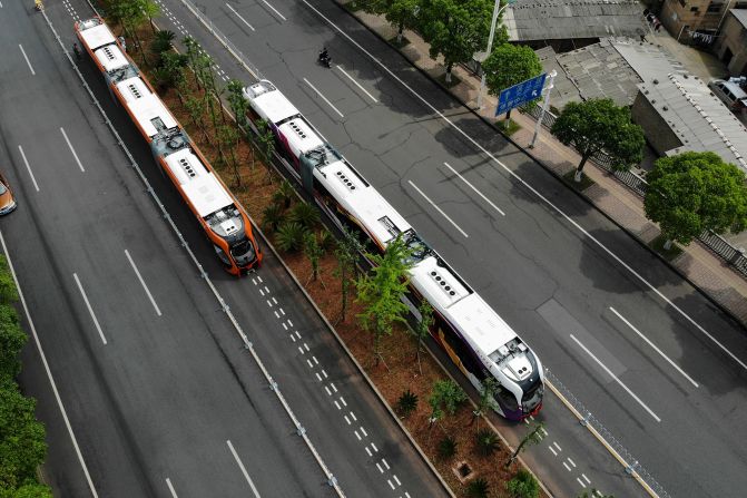 A hybrid between a bus and a train, "trackless trams" are like light rails, but are not restricted on where they can go. China Railway Rolling Stock Corporation (CRRC) debuted the world's first trackless tram in the city of Zhuzhou in 2018. The zero-emissions trams can drive for <a href="index.php?page=&url=https%3A%2F%2Fwww.crrcgc.cc%2Fen%2Fg7389%2Fs13996%2Ft292853.aspx" target="_blank" target="_blank">25 kilometers </a>after a mere 10-minute charge. They hold up to <a href="index.php?page=&url=https%3A%2F%2Fwww.sutp.org%2Fare-chinese-trackless-trams-the-best-new-thing-to-hit-the-road-in-your-city%2F" target="_blank" target="_blank">500 passengers</a>, making them an attractive option for densely populated cities. 