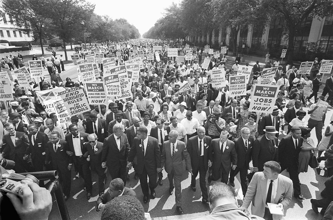 Dr. Martin Luther King Jr, third from left, and other civil right leaders lead the 1963 March on Washington.