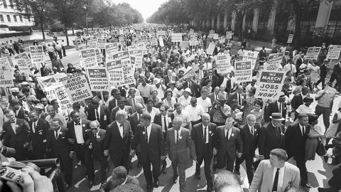 Dr. Martin Luther King Jr, third from left, and other civil right leaders lead the 1963 March on Washington.