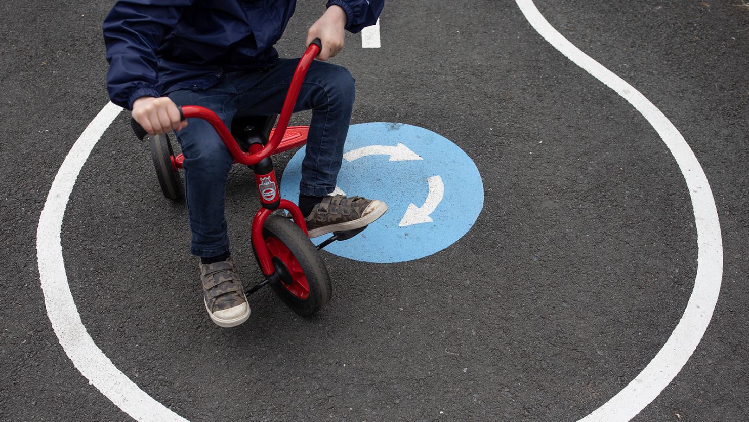 Children maintain social distancing measures in a London school playground in June 2020.