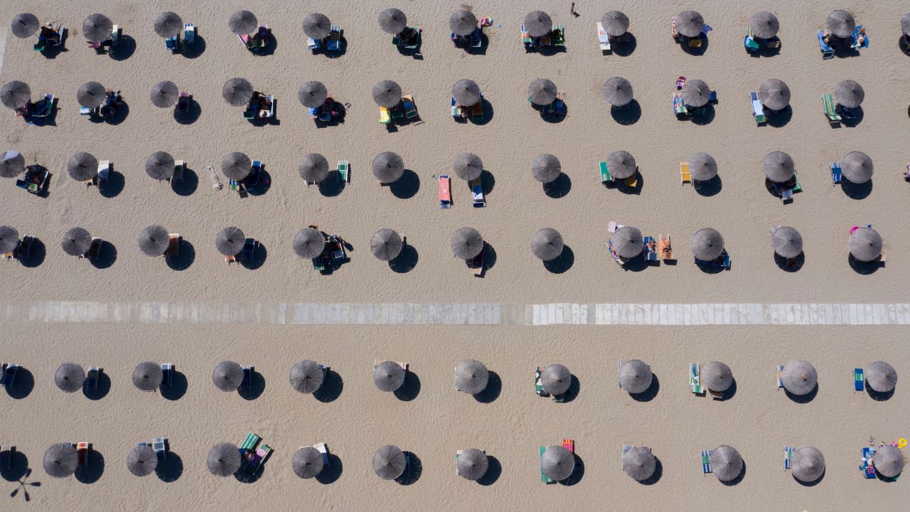 <strong>Durrës, Albania: </strong>Parasols are lined up on an beach of the Adriatic Sea on a day in late August, as a heatwave sweeps through Europe. 