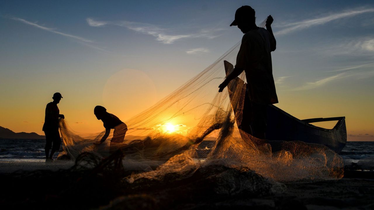 <strong>Banda Aceh, Indonesia</strong><strong>:</strong> Fishermen clean their nets after fishing on an August evening in the Indonesian capital. 
