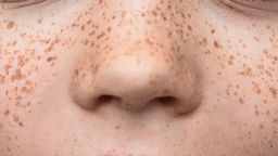 Close up of young boy with freckles