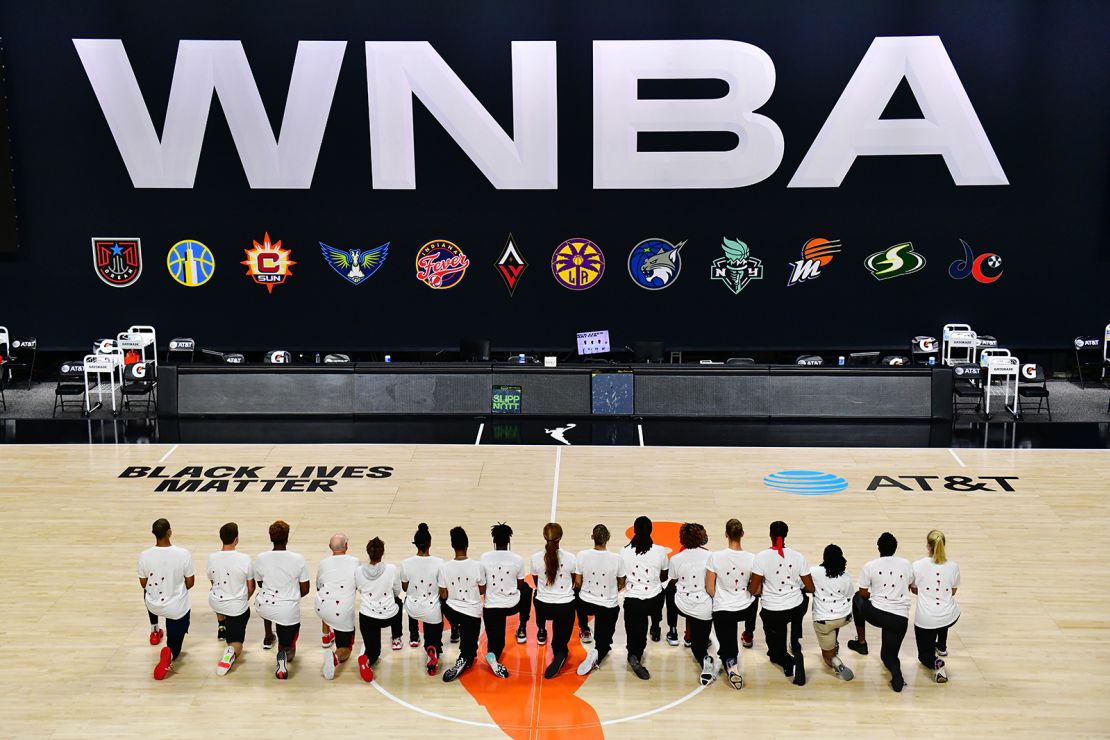 The Washington Mystics each wear white T-shirts with seven bullet holes on the back at Feld Entertainment Center on August 26, 2020 in Palmetto, Florida, as they protest the shooting of Jacob Blake by Kenosha, Wisconsin police 