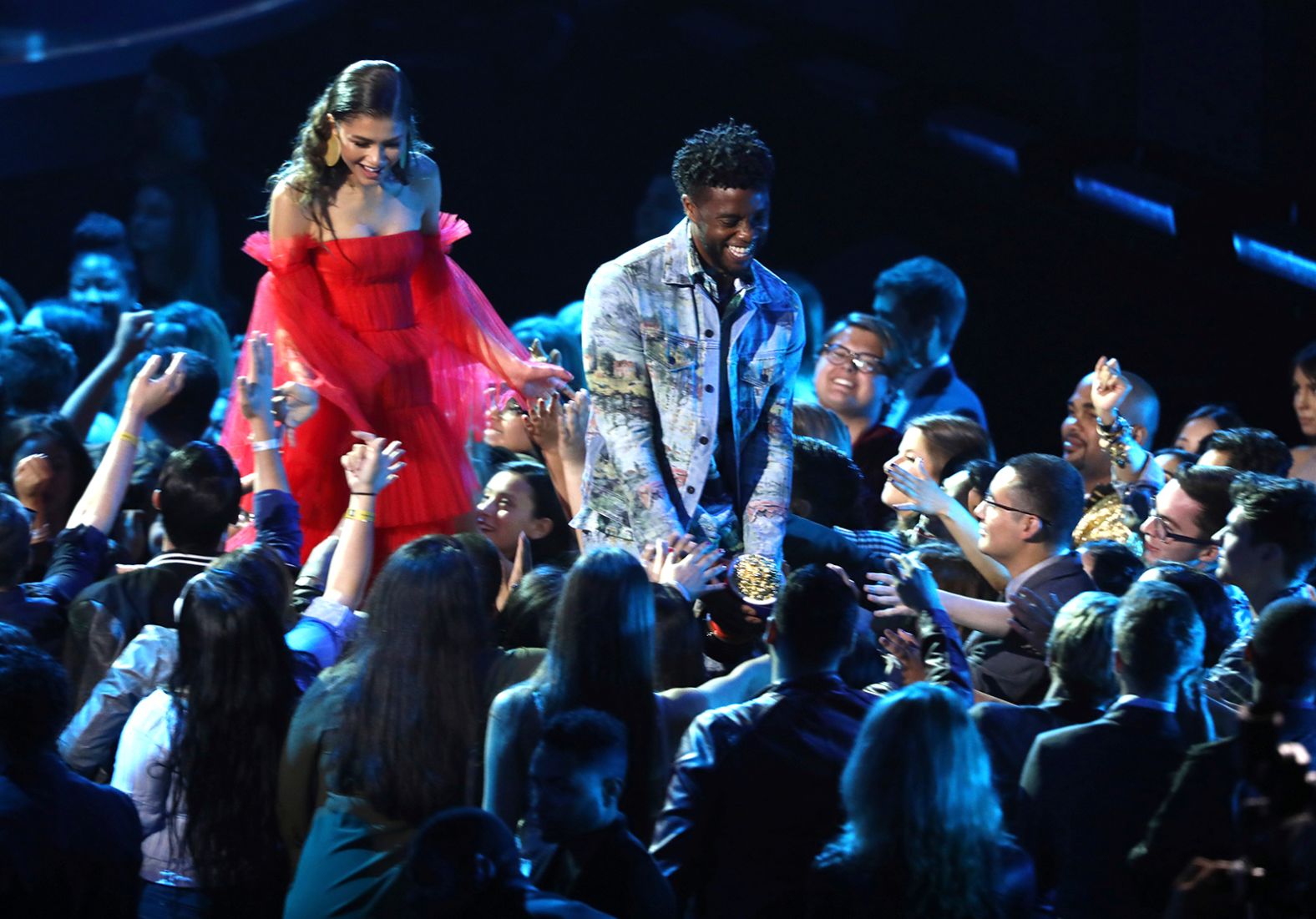 Boseman walks through the crowd after receiving an award at the MTV Movie and TV Awards in 2018.