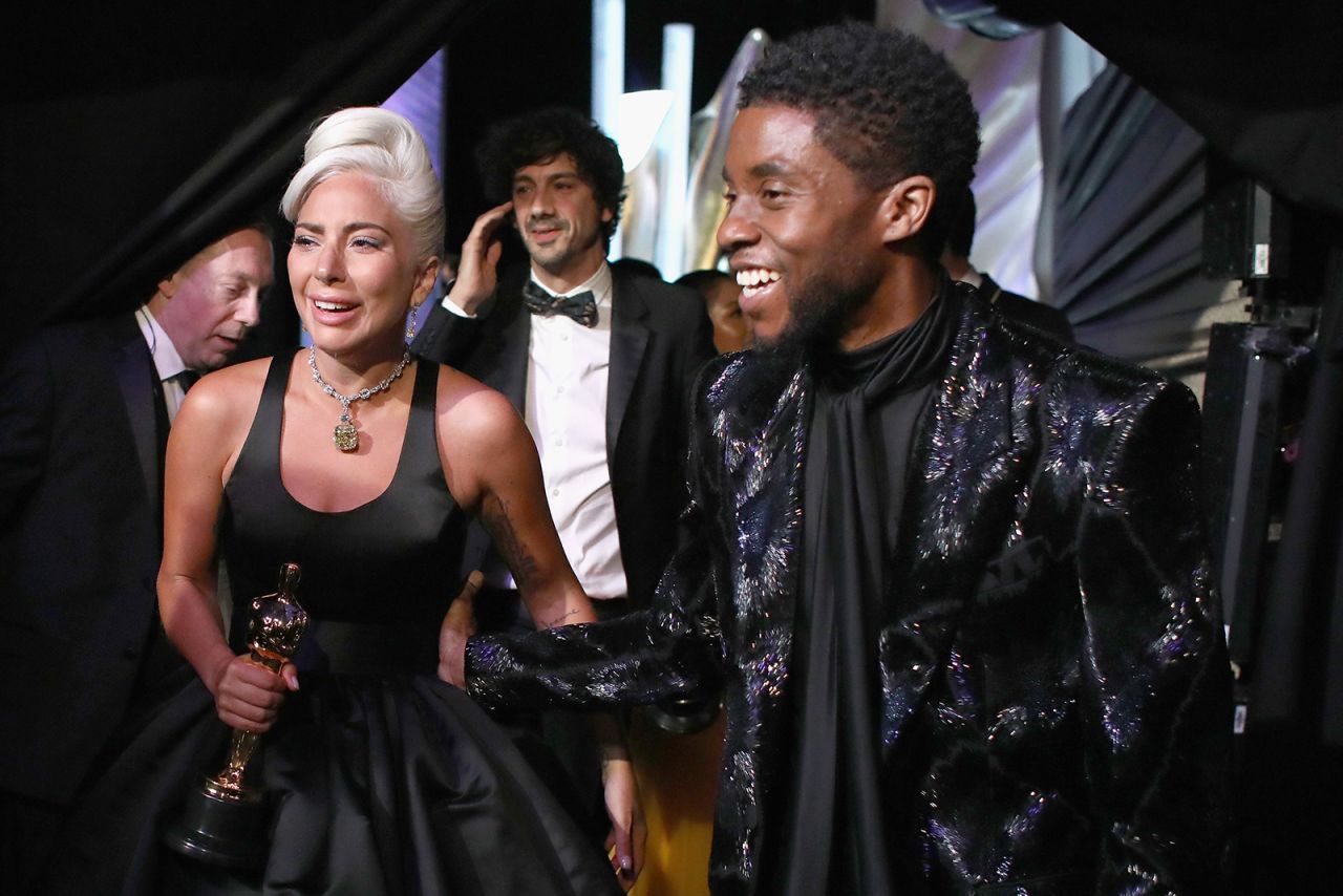 Boseman poses with Lady Gaga backstage after she had just won an Oscar in 2019.